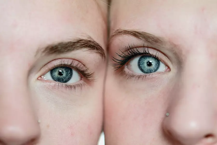 Side by side faces with identical eyes